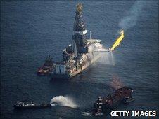 Ship recovering oil from spill site