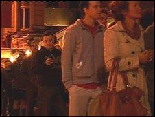 Voters queue outside a polling station