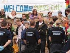 Campaigners and police face each other at the entrance of the Climate Camp in Hoo