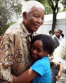 Nelson and Zenani Mandela hug in Soweto, South Africa, file pic from December 2008