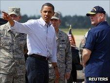US President Barack Obama walks with National Incident Commander US Coastguard Admiral Thad Allen at Gulfport Airport in Gulfport, Mississippi