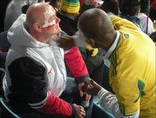 Fans put face paints on