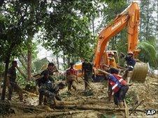 Bangladeshi army personnel clear the area in Cox's Bazar, on June 15, 2010