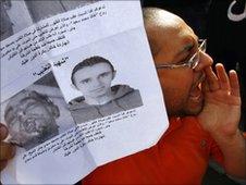 Activist with image of Khaled Said