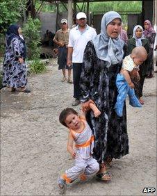 An ethnic Uzbek mother with her children inside a refugee camp at Begabad on the Kyrgyz-Uzbek border, 15 June