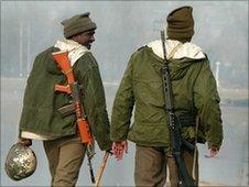 Indian Central Reserve Police Force (CRPF) personnel patrol along the banks of Dal-Lake in Srinagar, Kashmir on December 2, 2008