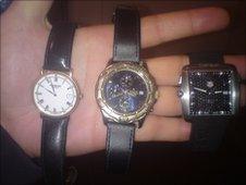 Stephen Taylor holding the stolen watches