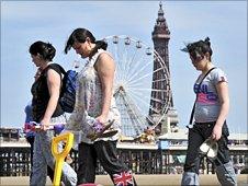 Holidaymakers on the beach in Blackpool