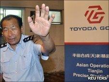 A security guard at the Toyoda Gosei plant in Tianjin