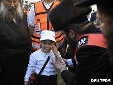 An ultra-orthodox Jewish girl cries in Jerusalem, 17 June