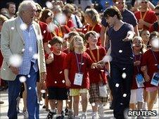 Michael Gambon (L) and Daniel Radcliffe (C) celebrate with fans