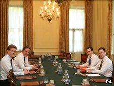 David Cameron, George Osborne, Nick Clegg and Danny Alexander in the Cabinet room at No 10 Downing Street