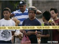 Residents looking at the crime scene