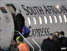 Raymond Domenech gets on a plane in South Africa