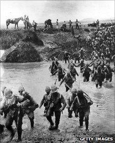 British soldiers cross a river during the Boer War circa 1900