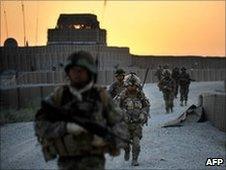 Soldiers patrol near Nahr e Saraj village, in Helmand on June 23, 2010