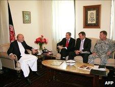 Afghan President Hamid Karzai (L) talks with US Special Representative Richard Holbrooke (2nd L), US Ambassador Karl Eikenberry (2nd R) and US General Stanley McChrystal (L) at the Presidential Palace in Kabul on 22 June2010