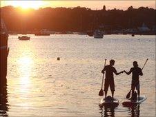 Charlie Head and Brad Symington on their stand-up paddle boards