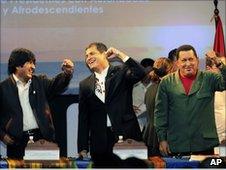 Presidents Morales, Correa and Chavez laughing together at the summit.