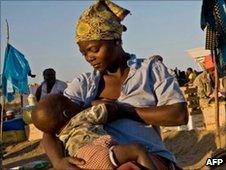 A mother and baby in Maputo, Mozambique, 9 June 2010