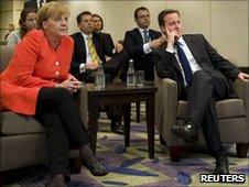 German Chancellor Angela Merkel and UK PM David Cameron watching the England v Germany match in Canada