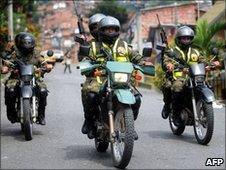 Soldiers on patrol in Medellin on 19 June 2010