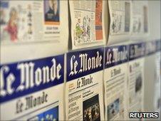 Pages of the day's last edition in the Le Monde office in Paris on 25 June 2010