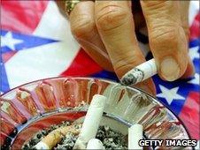 A hand holding a cigarette