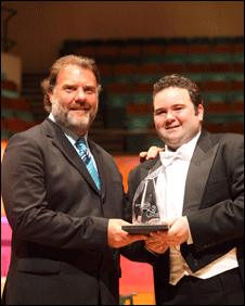 Bryn Terfel presents John Pierce, from Holywell, Flintshire, with his Welsh Singers Competition 2010 trophy