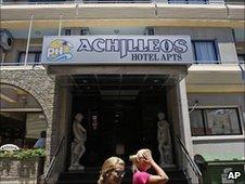 Women pass outside of the hotel where Christopher Metsos was believed to have been staying in Larnaca, Cyprus, on 30 June 2010