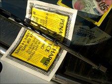 A parking ticket on the windscreen of car