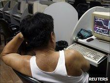 Chinese trader in front of screen