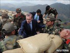 Turkish Prime Minister Tayyip Erdogan (centre) visits troops near the border with Iraq, 20 June 2010