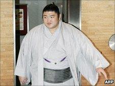 Sumo wrestler Kotomitsuki arrives at the Japan Sumo Association's executive meeting on 4 July 2010