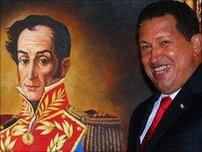 Venezuelan Hugo Chavez stands next to a portrait of Simon Bolivar