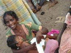 Injured Tamil woman and child, 2009 file pic