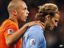 Uruguay's Diego Forlan (right) and Holland's John Heitinga