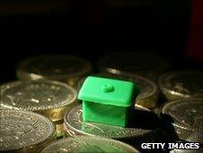 Monopoly piece on cash