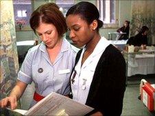 Nurses discussing patient's notes