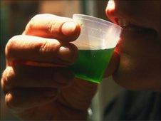 Man drinking methadone