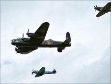 Hurricane, Lancaster Bomber and Spitfire during flypast at RAF Fairford in Gloucestershire