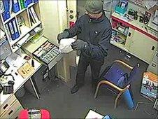 CCTV of robber at travel agent