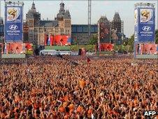 Holland fans watch the game on a large screen near the Rijksmuseum