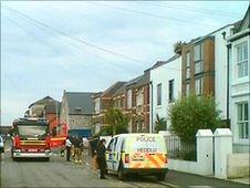 Fire officers and police at the scene of the blaze