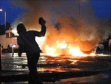 Car burning during rioting in the Ardoyne area of north Belfast