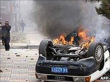 A burning car in the Tibetan capital Lhasa after protests (March 2008)