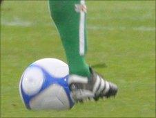 Guernsey footballer's leg and football