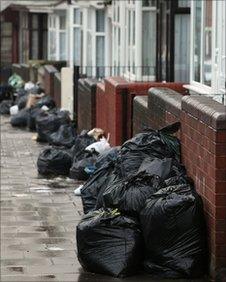 Rubbish bags piled up in a Birmingham street