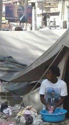 A woman in a tent washes her hands