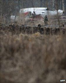 A Russian soldier guards wreckage from the Polish airliner at the crash site near Smolensk, 11 April 2010